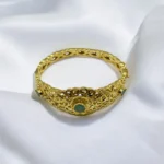 Bracelet traditionnel en or 18k avec émeraude